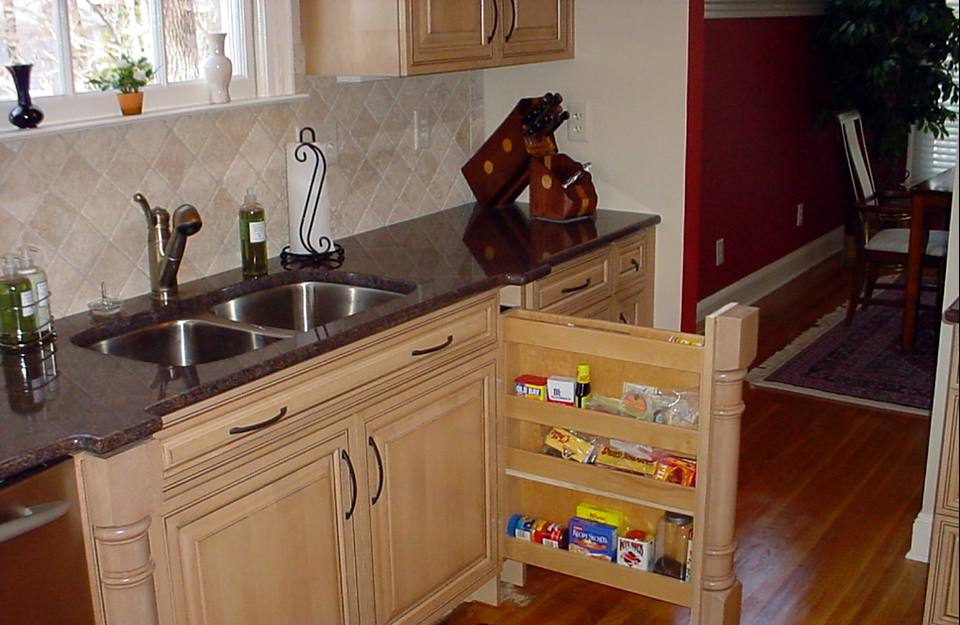 Pull-out pantry cabinet beside the kitchen sink