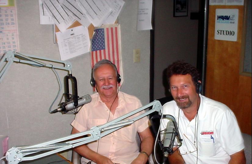 Mark Marcley and his father, Henry, seated at radio studio microphones