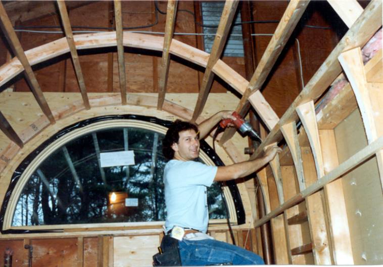 A young Mark Marcley framing a barrel-vaulted ceiling around a half-round window